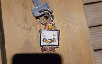 Found: Door key with key ring saying (FunCenter) with dog holding that as a sign