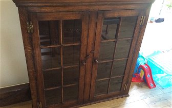 For sale: Titmarsh and Goodwin display cabinet in solid oak.