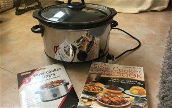 For sale: Crockpot Slow Cooker. Includes Slow Cooker Liners & Cookbook Sold