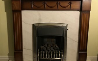 For sale: Gas fire in marble surround and hearth with wooden surround