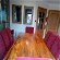 For sale: Large dining table and 8 red velour high rolled back chairs