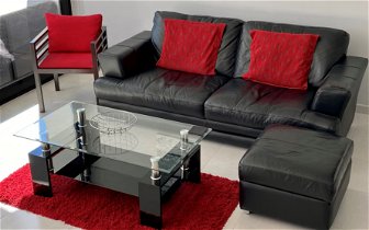 For sale: 2 Seater Black Leather Sofa, Storage Pouffe & Other Items