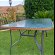 For sale: Glass topped patio table.