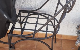 Spray painting of black iron chairs