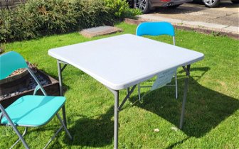For sale: Fold up camping table and two folding chairs