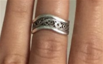 Lost: Lost: An intricate, silver ring with a wavy band
