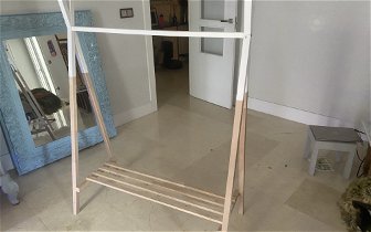 For sale: kids wooden clothes rack with shelving below