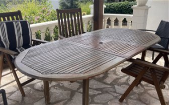 For free: Teak Table sits 8 comfortable when extended without chairs